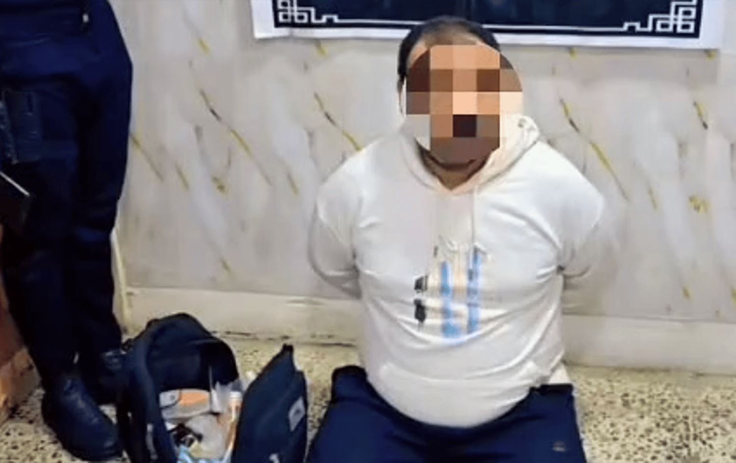 متهم في قبضة شرطة الكرخ