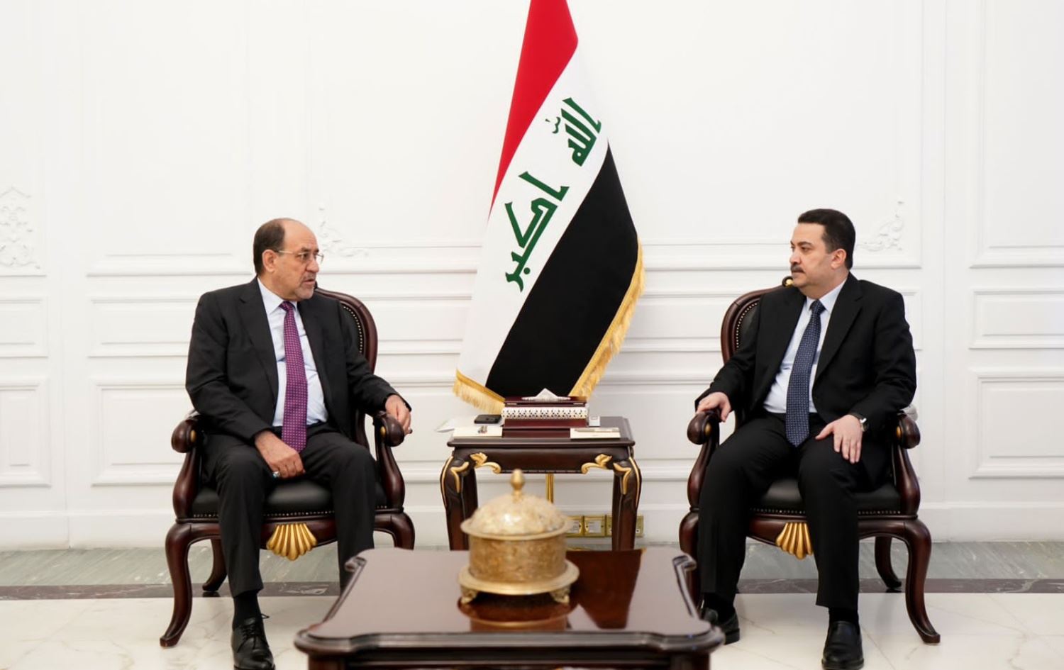 محمد شياع السوداني ونوري المالكي