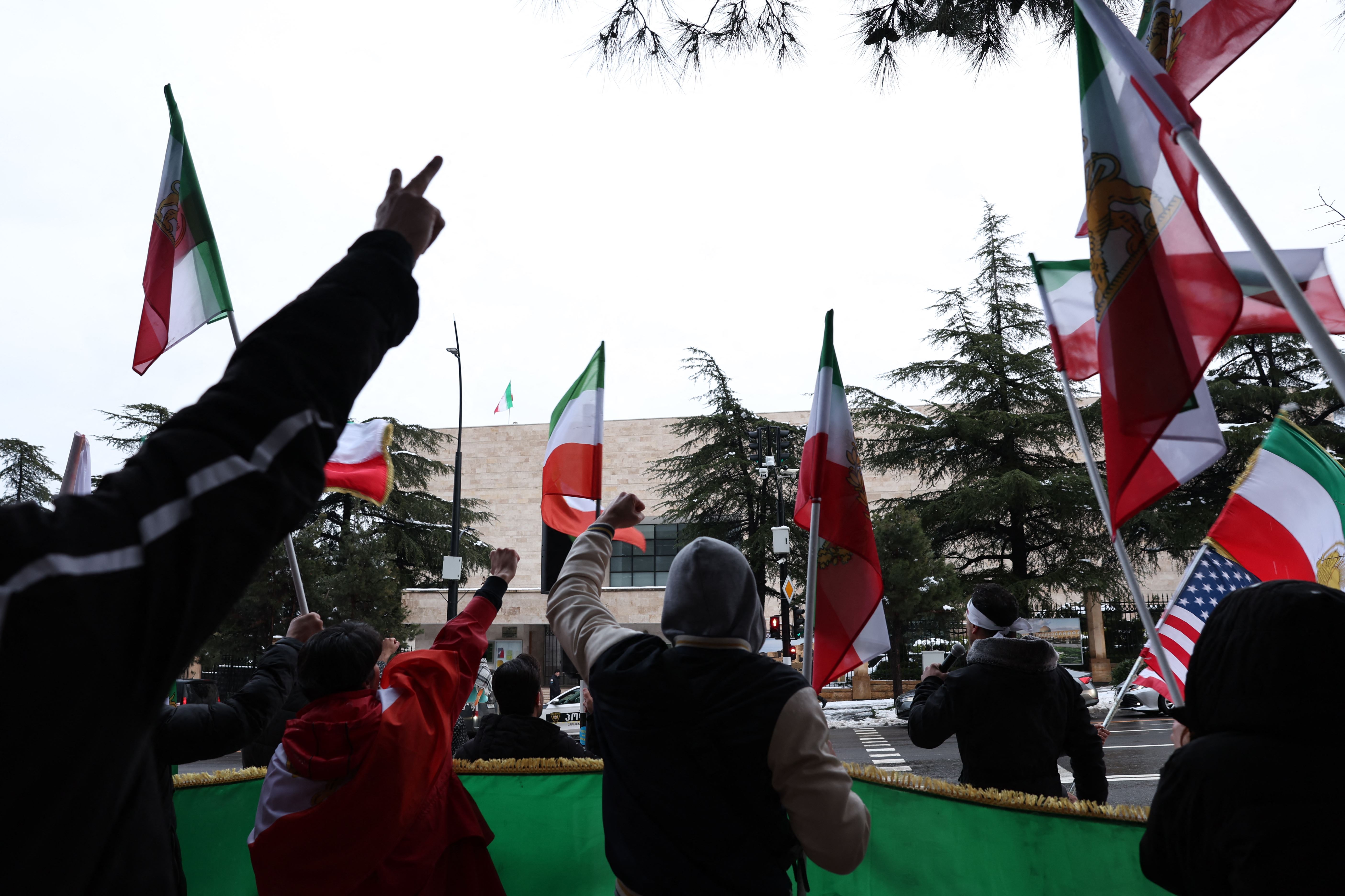 Members of the Iranian diaspora raise their fists as they take part in a rally in front of the Iranian Embassy in Tbilisi on February 28, 2026, following the US and Israel's strikes on Iran. Photo: AFP 