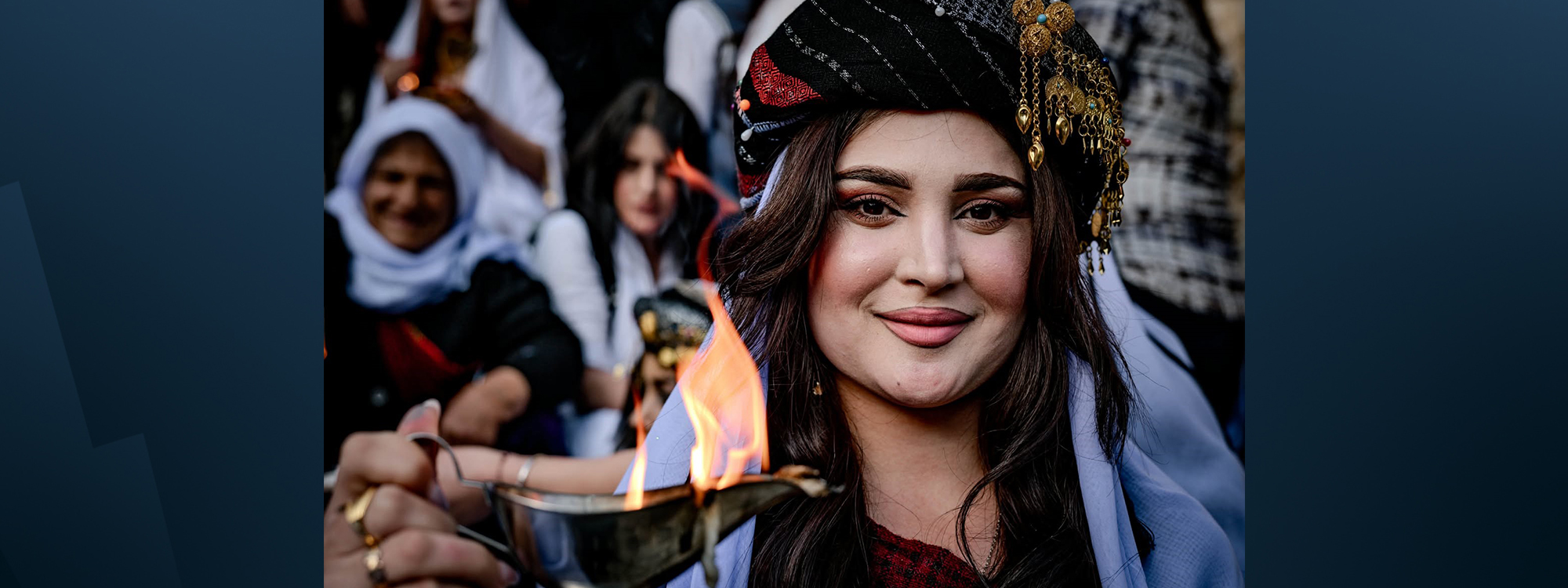 A Yazidi girl holds up a lamp with a flame at Lalish Temple, Lalish Temple - the Yazidis’ holiest site in Shekhan district, located in the Kurdistan Region’s northern Duhok province.. Photo: Bilind T. Abdullah/rudaw